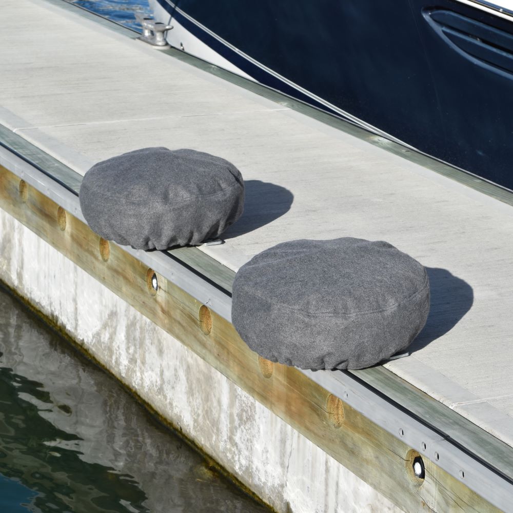 Fleece covered PVC dock wheel covers, the best option for boats with a vinyl wrapped hull.  For marina berths, available from Hauraki Fenders