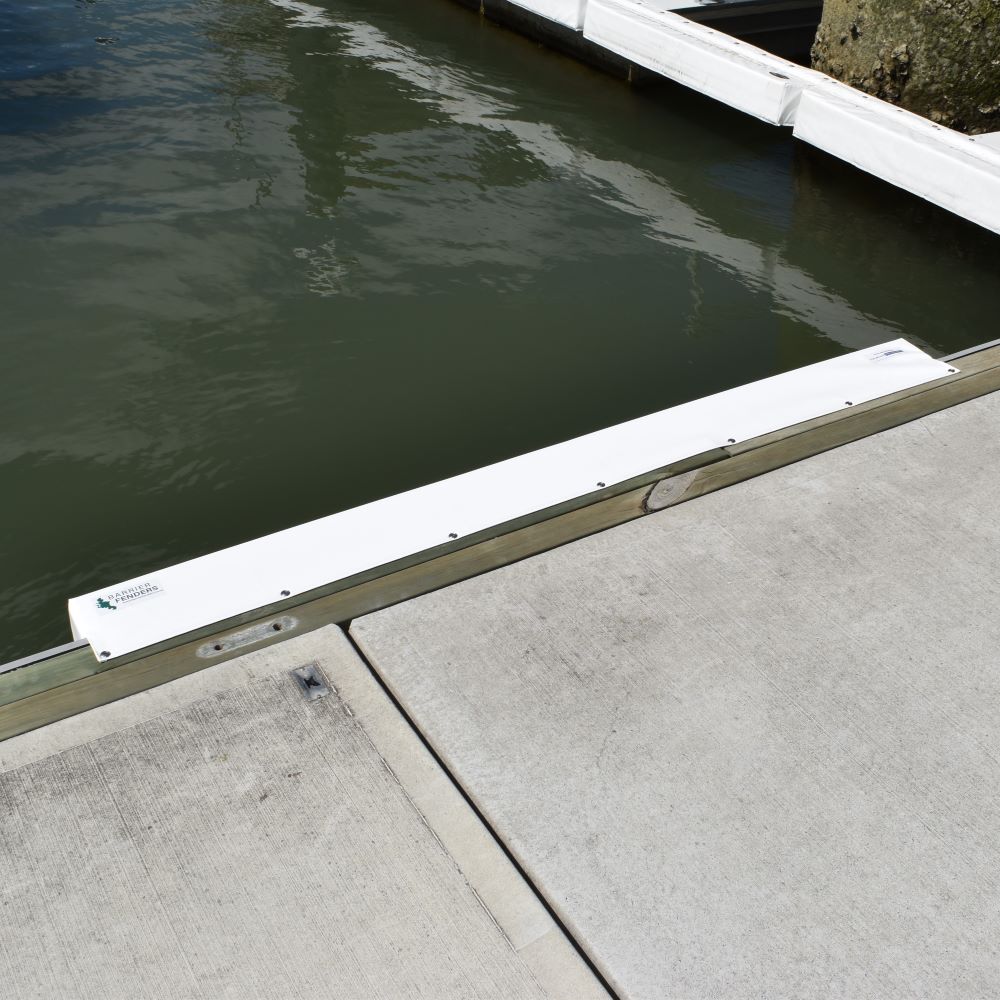 Contoured Barrier Fenders available from Hauraki Fenders - 2m pvc covered foam marina fender shaped to fit around a marina berth rub strip