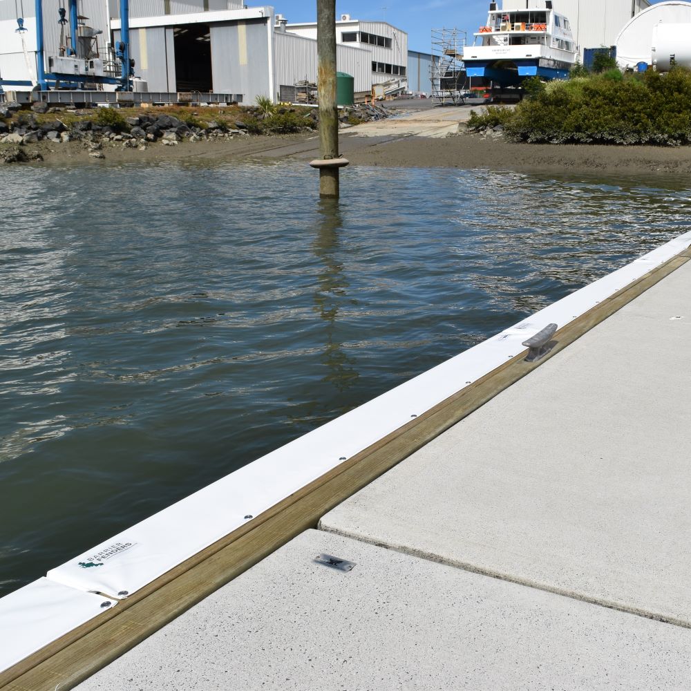 Contoured Barrier Fenders available from Hauraki Fenders - 2m pvc covered foam marina fender shaped to fit around a marina berth rub strip